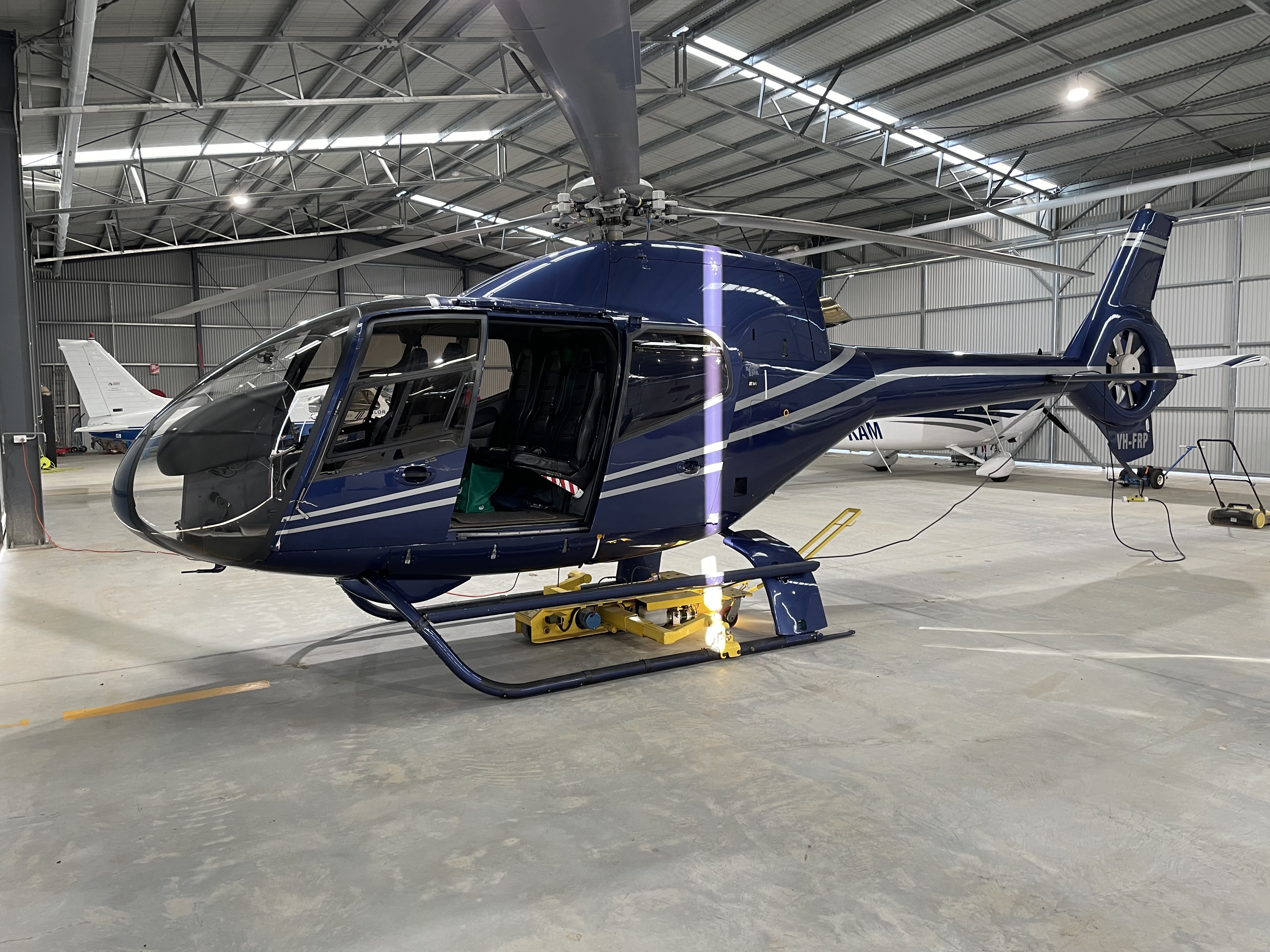 Chopper Spotter Model E ground handling robots under VH-FRP
